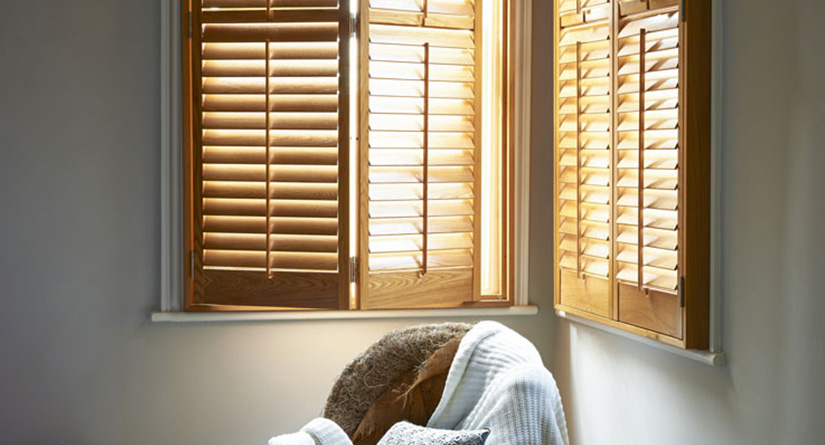 Stained plantation shutters on two walls