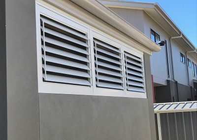External plantation shutters on one wall