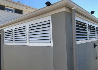 External plantation shutters over two walls
