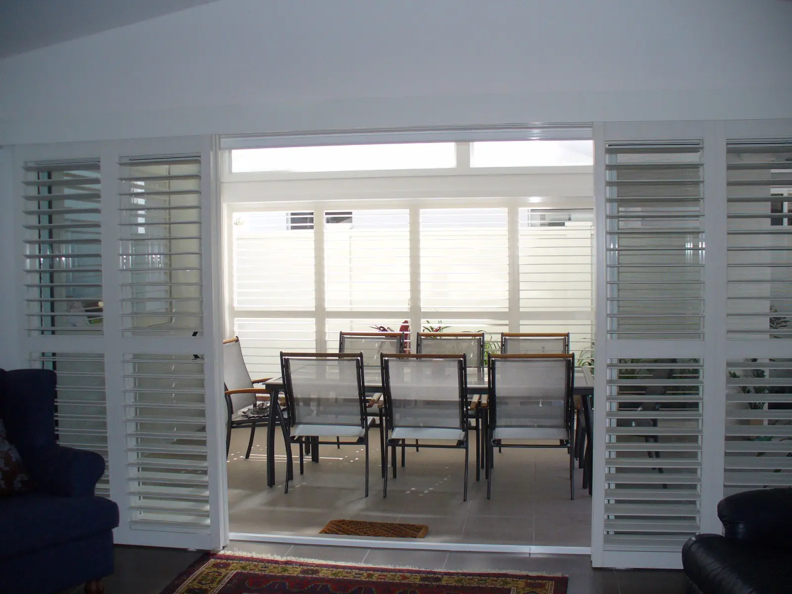 Outdoor patio with plantation shutters