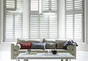 Multiple plantation shutter configurations on a wall