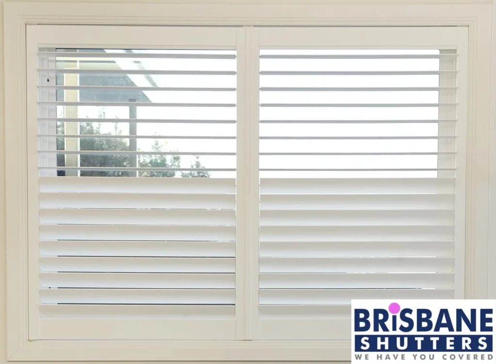 White plantation shutters with top half open