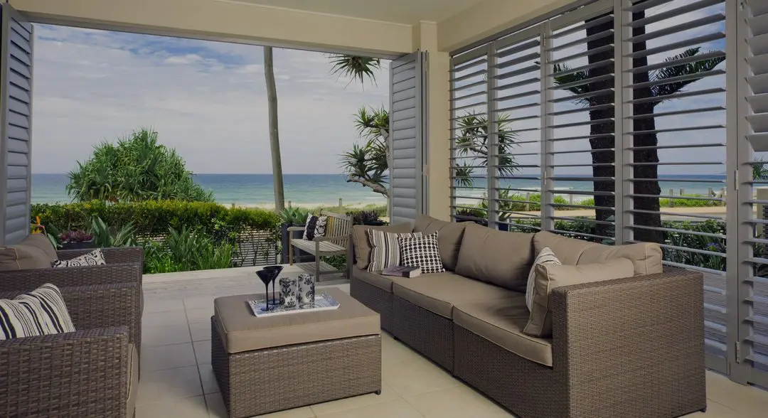 Luxurious outdoor patio with plantation shutters