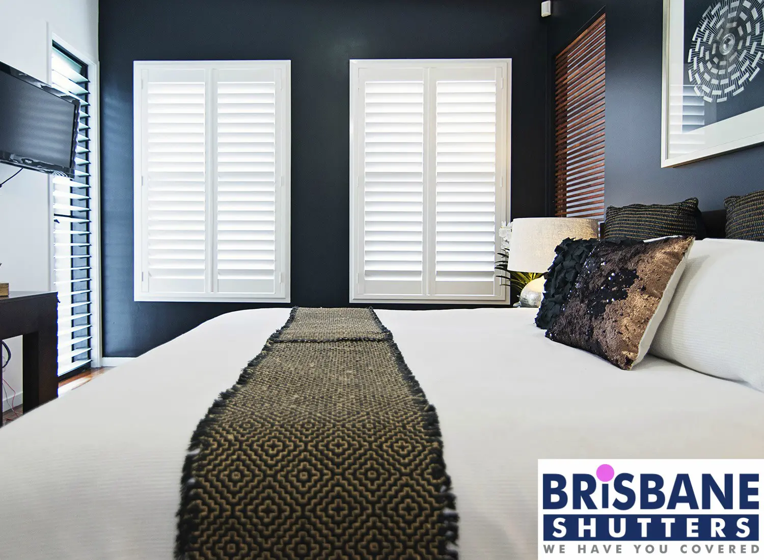 Dark blue room with white plantation shutters