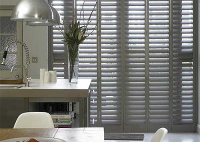 kitchen view with plantation shutters in background