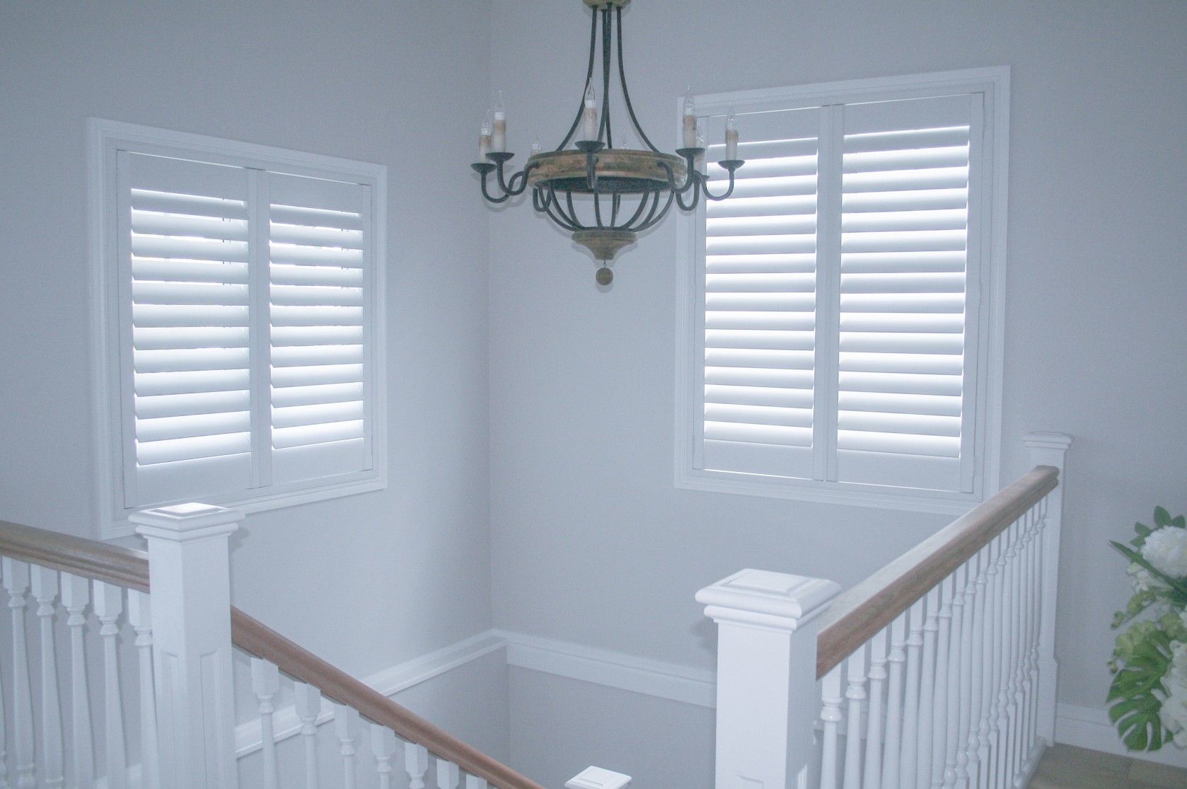 Plantation shutters over staircase