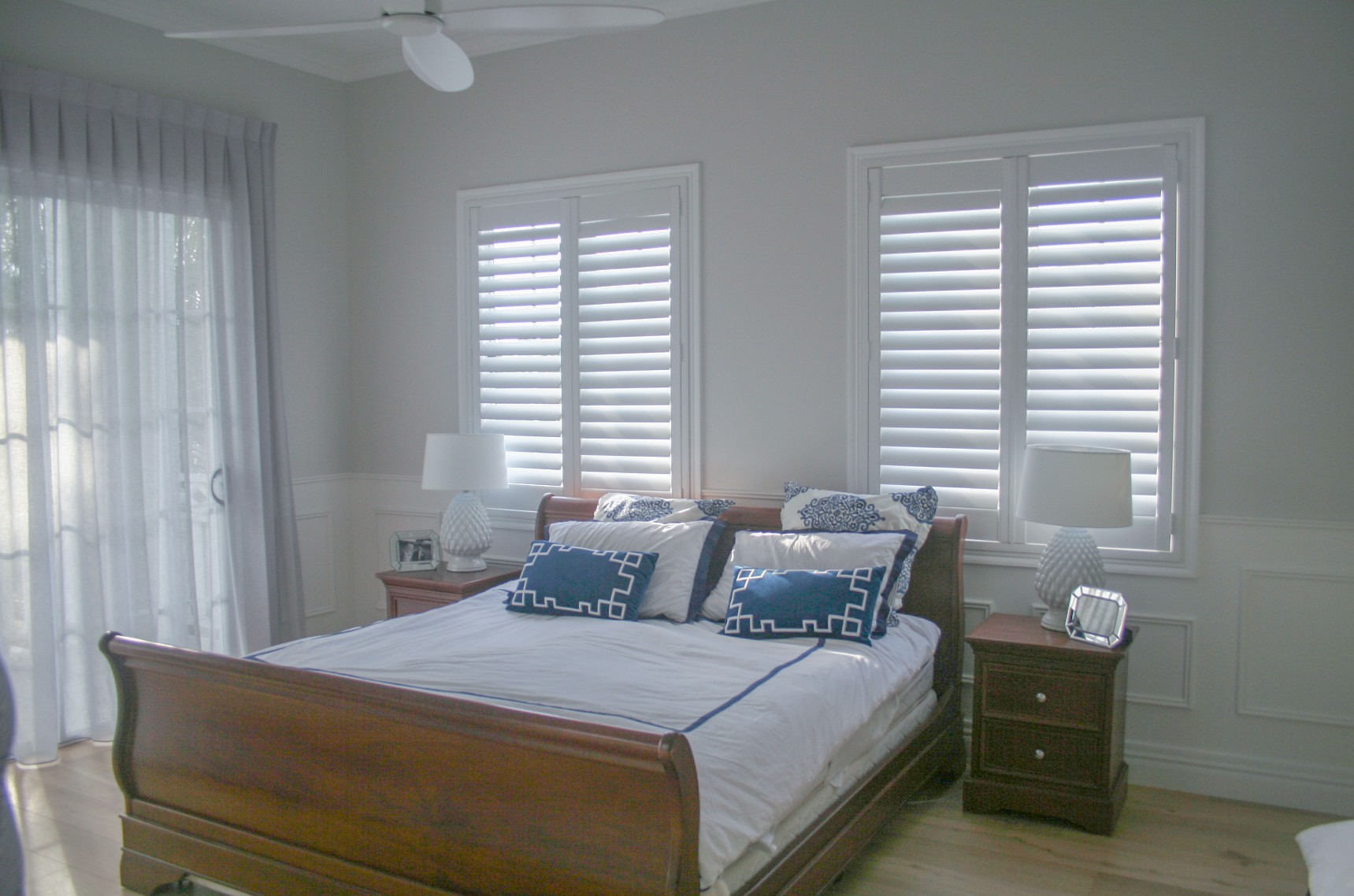 White plantation shutters installed in master bedroom