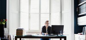 Man deciding on plantation shutters